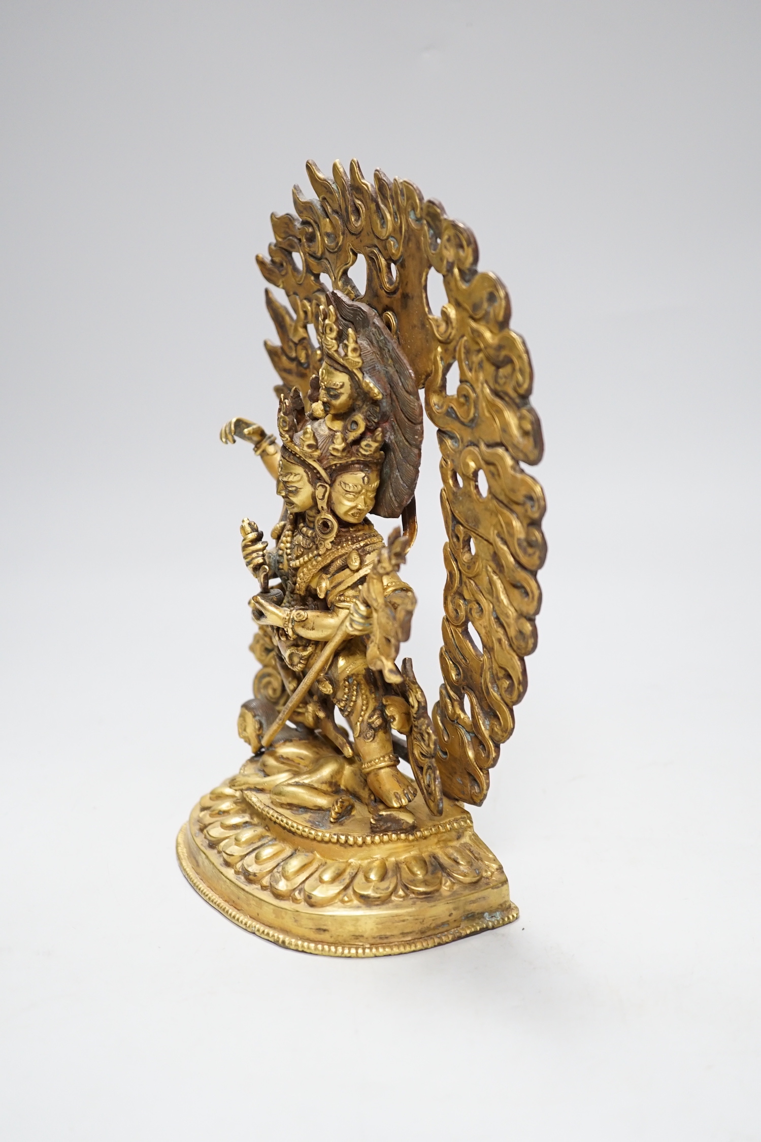 A Sino Tibetan gilt bronze figure of Mahakala, 23cm